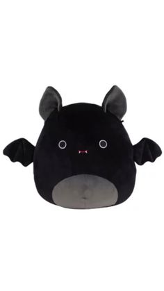 a black stuffed animal with horns and eyes