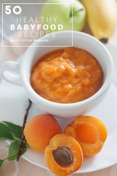 an apple, apricot and banana dessert on a white plate with fruit around it