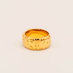 Crafted of gold with a titanium core, this hammered texture ring has a seemingly organic feel that brings a natural touch to any ensemble. Materials: Finish: 18K gold platedCore: Titanium steel Gold Hammered Wide Band Ring, 14k Gold Hammered Wide Band Ring, Modern Wide Band Ring With Hammered Detail, Formal Hammered Wide Band Ring, 14k Gold Hammered Thick Band Ring, Hammered 14k Gold Wide Band Ring As Gift, Hammered Yellow Gold Wide Open Band Ring, Hammered Yellow Gold Wide Band Open Ring, Hammered Wide Band Open Ring For Anniversary