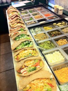 an assortment of food on display at a restaurant