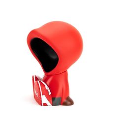 a small red toy with its mouth open