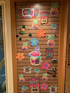 a door decorated with tropical stickers and magnets