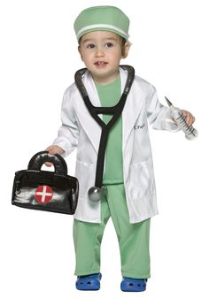 a little boy dressed up as a doctor with a bag and stethoscope