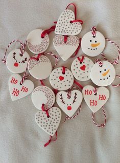 christmas ornaments are arranged in the shape of snowmen and heart shaped ornament