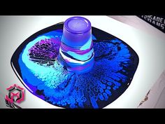 a blue and purple object on top of a black plate