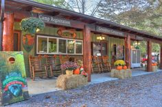 an outdoor store with hay bales and pumpkins