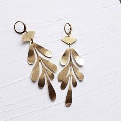 Long Textured Yellow Brass Leaf Dangle and Drop Statement Earrings:  Be bold with these pretty long and lightweight brass earrings. All of the components are raw brass, including the comfortable hook ear wires.  I love how the shape and subtle texture adds just the right amount of detail to frame your face! Arrives beautifully packaged, ready for gift giving. Handmade in the USA.►3.25" Long ApproximatelyTo see more items from my shop, click here: brazedbrand.etsy.comYou can also find me here:ins Metal Jewelry Handmade, Jewelry Trending, Custom Initial Necklace, Statement Drop Earrings, Subtle Textures, Brass Earrings, Raw Brass, Leaf Earrings, Be Bold