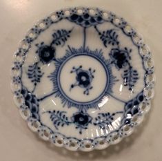 a blue and white plate sitting on top of a table