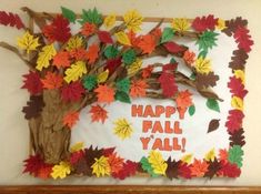 an autumn bulletin board with fall leaves and branches on it that says happy fall y'all