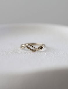 14k solid gold double wave ring. Inspired by water ripples. Ideal also as a wedding band for her.  14k solid gold  Width(widest part): 0.5 cm | 0.2 inch  Packed in labeled gift box  Handmade  Feel free to contact us for details and special requests  All items can be ordered in 14k/18k yellow, white or rose solid gold  Please review terms and conditions before checkout For more rings:  https://www.etsy.com/shop/YajewelryShop?ref=simple-shop-header-name&listing_id=484967002&section_id=30745115 Gold Wave Ring, Wedding Bands For Her, Water Ripples, Wave Ring, Ring White Gold, Box Handmade, Etsy Gold Ring, White Gold Ring, White Gold Rings