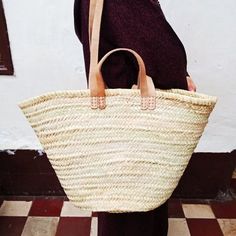 The Moroccan straw basket is handwoven from natural palm leaves.Whether it's for a day at the beach or for a trip to the farmers' marketThis Moroccan straw basket with double leather handle is perfect for carrying your daily essentials,You just found your perfect companio.- Size (Approx): 55 cm x 35 cmPlease note the size can be small about two cm or three cm because it's handmade product.Note: All of our bags are 100% handmade natural palm leaves.Please note: Due to their handmade nature, our M Natural Straw Bag With Double Handle For Market, Natural Double Handle Straw Bag For Market, Palm Leaf Straw Tote Bag For Market, Palm Leaf Straw Bag With Braided Handles For Market, Summer Basket Straw Bag With Rolled Handles, Summer Basket Beach Bag With Rolled Handles, Natural Basket Beach Bag For Market, Summer Market Straw Bag With Bamboo Handle, Summer Casual Use Straw Bucket Bag