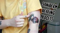 a person with some tattoos on their arm and the words sandderm healing process