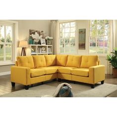 a yellow sectional sofa in a living room