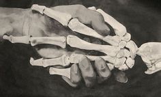 two hands holding each other with bones in the middle and one hand on top of another