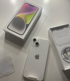 an apple iphone is sitting next to its box