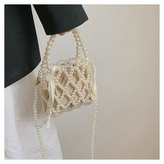 Add a touch of elegance and uniqueness to your accessory collection with our Handmade Pearls Handbag. This DIY Purse Mini Beaded Bag is meticulously crafted with high-quality pearls, offering a timeless and sophisticated look. Perfect for special occasions or as a stylish everyday accessory, this handbag is designed to be both functional and fashionable. Features: High-Quality Materials: Made with premium pearls that shine and add a luxurious touch to your ensemble. DIY Craftsmanship: Each bag i Handbag Diy, Beaded Earrings Diy, Diy Handbag, Diy Purse, Mini Handbag, Beaded Bag, Diy Set, Everyday Accessories, Bracelets Handmade Beaded