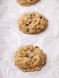 oatmeal chocolate chip cookies lined up on parchment paper