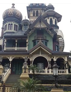 an ornate house with many windows and balconies