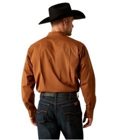 Embrace your inner cowboy with the Ariat Mens Relentless Pursuit Classic Fit Shirt. Featuring pearl snaps, this shirt offers a classic fit that is ready for the rodeo or the dance floor. Make a statement with this stylish and durable shirt that is perfect for any true cowboy's wardrobe. Ride in style and comfort with Ariat. Material: 98% Cotton / 2% Elastane Innovation And Technology, Womens Cowgirl Boots, Womens Work Boots, Button Outfit, Mens Cowboy Boots, Long Sleeve Kids, Boys Bottoms, Vests Mens, Cowboy Boots Women