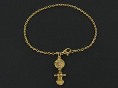 Tribal Ashanti women's figurine pendant bracelet. Pendant is made of gold plated pewter. Gold plated bracelet chain - 6, 6 1/2, 7, 7 1/2, 8, 8 1/2, 9 inches long ---------------------------------- Jewelry in this collection: Bracelet - https://www.etsy.com/listing/1401678882/tribal-person-people-bracelet-ashanti Pierced earrings - https://www.etsy.com/listing/907239896/tribal-person-people-earrings-ashanti Clip on earrings - https://www.etsy.com/listing/902478646/tribal-woman-clip-on-earrings-go Brass Charm Bracelet As Gift, Brass Chain Charm Bracelet Gift, Gold Chain Bracelet With Adjustable Chain For Spiritual Wear, Gold Metal Bracelet With Charms, Gold Symbolic Charm Bracelet, Symbolic Gold Charm Bracelet, Nickel-free Gold Metal Charm Bracelet, Spiritual Gold-tone Metal Jewelry, Gold Symbolic Metal Charm Bracelet