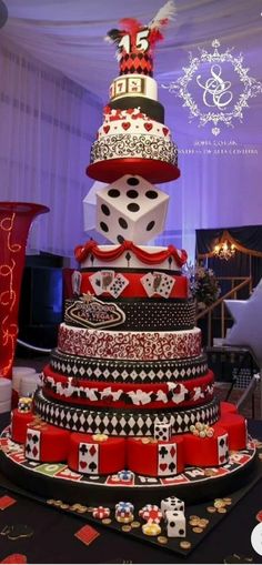 a multi tiered cake with dice on top