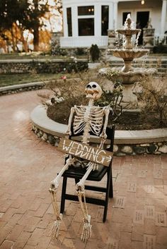 a skeleton sitting in a chair with the word wedding written on it