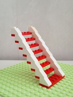 a lego staircase made out of red and white bricks