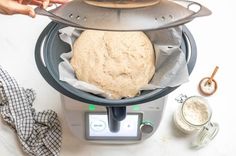 a person is making bread in an air fryer