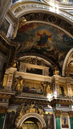 the interior of a church with many paintings on it's walls and ceilinging