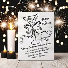 a white card with an octopus on it next to two candles and some sparklers