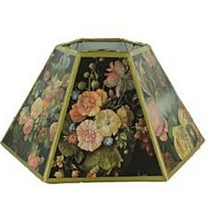 a lamp shade with flowers painted on it