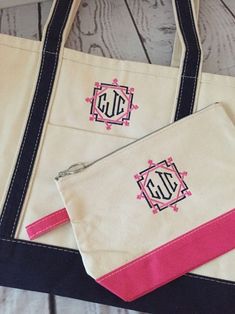 two monogrammed bags with zippers on them