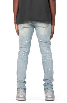 Threadbare holes, spatters of paint and dirty, grungy fading bring lots of signature appeal to these low-rise skinny jeans made with a hint of stretch. 32" inseam, 10" leg opening; 10" front rise; 15" back rise (size 29) 98% cotton, 2% Lycra® spandex Machine wash, line dry Imported Asian Owned/Founded Spring Streetwear Jeans With Paint Splatter, Fitted Denim Jeans With Paint Splatter, Fitted Paint Splatter Denim Jeans, Spring Fitted Jeans With Paint Splatter, Fitted Paint Splatter Jeans, Casual Fitted Jeans With Paint Splatter, Urban Cotton Bottoms With Paint Splatter, Urban Style Paint Splatter Jeans For Streetwear, Urban Style Cotton Bottoms With Paint Splatter