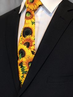 "Cheer up with this bright and colorful sunflower tie. This sunflower necktie is available as a extra long tie and a skinny tie. Pocket Square available upon request pending available of fabric. Cost is $10.99 Message me to check availability. Expertly hand-made from 100% cotton you can select your length from 57\" to 71\" (Great for taller Men). Width is standard 3.5\" as shown here or skinny 2.5\". If you require a custom length or width, please contact us. 2.5\" x 48\" Child size available up