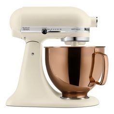 a white and gold kitchen mixer on a white background