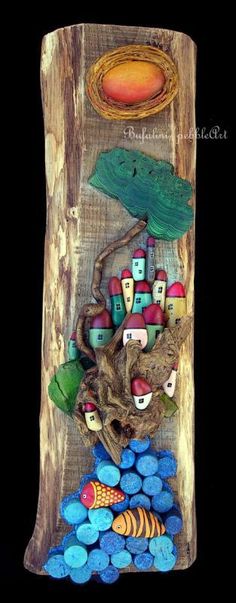 a wooden sculpture with many different items on it