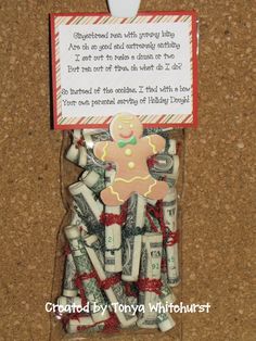 a gingerbread man made out of candy canes in a package with a note attached