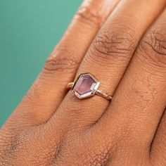 Enhance your style with this modern and artful 1.04ct abstract geo sapphire ring! Beautiful purple-pink color, it features an "abstract" geometric portrait cut. It's presumed to be heated, a permanent treatment for its stunning color and clarity. The bezel-face included makes the ring measure 9.97x8.22mm. With a low profile bezel setting and hand-carved, recycled 14k yellow gold design, this ring can be either polished or matte/satin by request. Treat yourself to something special today! Center Portrait Cut Ring, Purple Sapphire Ring, Geometric Portrait, Purple Pink Color, Purple Sapphire, Bezel Ring, Purple Abstract, Soft Purple, Jewelry Ring Box