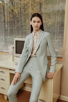 Stand out with this refreshing mint green suit. The light color and tailored fit make it ideal for making a stylish impression. Whether you're attending a springtime wedding, a garden party, or a special event, this suit guarantees you'll look elegant and chic. Elegant Spring Suit With Suit Collar, Elegant Notch Lapel Pantsuit For Spring, Spring Chic Fitted Suits, Elegant Spring Pantsuit With Notch Lapel, Fitted Chic Spring Suits, Spring Tailored Single Button Pantsuit, Elegant Spring Blazer With Pressed Crease, Spring Semi-formal Single Breasted Pantsuit, Spring Tailored Single-button Pantsuit