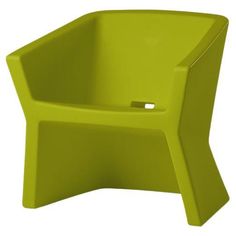 a green plastic chair sitting on top of a white floor