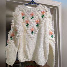 Chicwish Hand Knit Floral Sweater White Embroidered Knit Cardigan, Hand Knitted White Sweater For Fall, White Hand Knitted Long Sleeve Sweater, White Chunky Knit Crew Neck Cardigan, Embroidered White Cardigan For Winter, White Soft Knit Sweater For Spring, White Crew Neck Soft Knit Cardigan, White Textured Knit Long Sleeve Sweater, Oversized Embroidered White Sweater