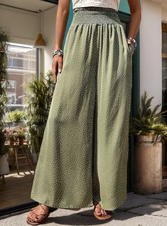 Polka dot pants are perfect for adding a touch of fun to your summer wardrobe. Discover these charming olive green wide-leg pants, adorned with a subtle white polka dot pattern. The smocked high waist provides a snug and flattering fit, while the wide-leg silhouette offers a breezy and relaxed feel. Perfect for a range of activities, from beach walks to brunch dates, these pants can be styled with a simple tank top and flip-flops for a laid-back vibe or paired with a fitted top and strappy sanda Stay Cool In The Heat, Simple Tank Tops, Brunch Dates, Beach Walks, Olive Green Pants, Polka Dot Pants, Stylish Pants, Fitted Top, Green Pants