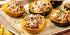 stuffed acorns with meat and cheese on a baking sheet