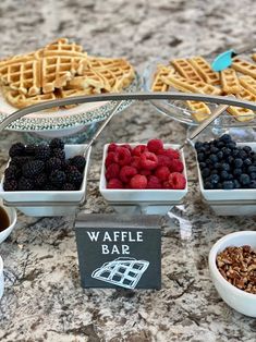 the waffle bar is full of fresh berries, raspberries and blueberries