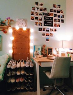 there is a desk with shoes on it and pictures hanging on the wall behind it