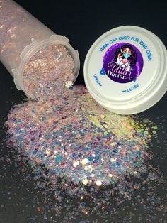 the glitter powder is next to an empty container