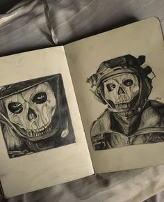 an open book with two drawings of skulls on it