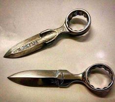 two pairs of scissors sitting next to each other