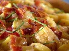 potatoes with bacon and chives in a bowl