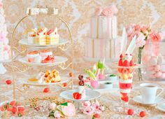 a table topped with lots of different types of desserts